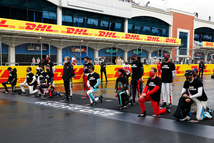 F1 drivers take a knee on the grid in support of the Black Lives Matter movement prior to the F1 Grand Prix of Turkey at Intercity Istanbul Park on November 15 2020 in Istanbul.