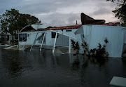 Flood water from Hurricane Irma surround a damaged mobile home in Bonita Springs, Florida, US, September 10, 2017. 