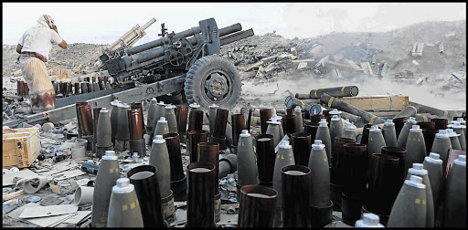 WAR ZONE: A tribal fighter loyal to Yemen's government fires a cannon at a Houthi position in Yemen's central province of Marib. Picture: REUTERS