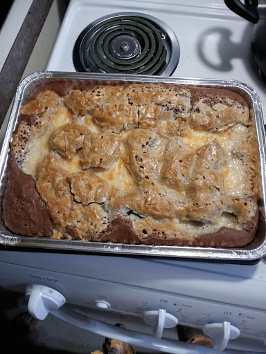 A wrecked looking German Chocolate cake mix base.  Chopped Pecans and Coconut under the cake mix with a cream cheese, butter and powder sugar mixture poured on top but not mixed in.  I've been making it for 26 years now. Delicious!
