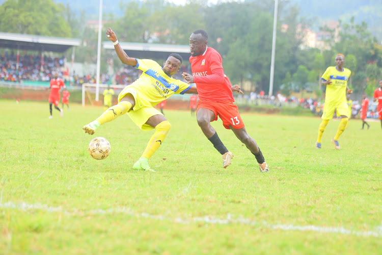 Migori Youth's Josephat Kegege vies for the ball with Shabana's Cornelius Juma during an NSL game at Gusii Stadium