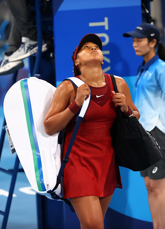 Naomi Osaka of Japan walks off after losing her third round match against Marketa Vondrousova of Czech Republic