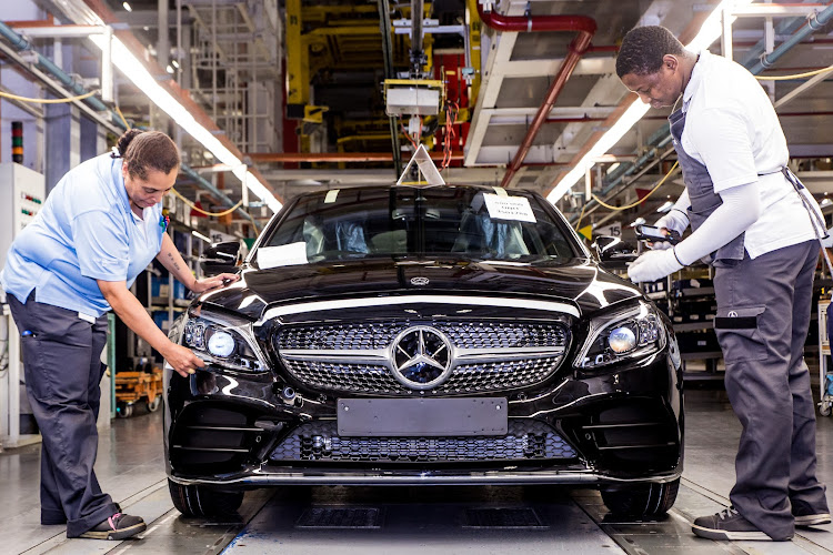 A Mercedes-Benz C-Class rolls off the line at the East London plant.