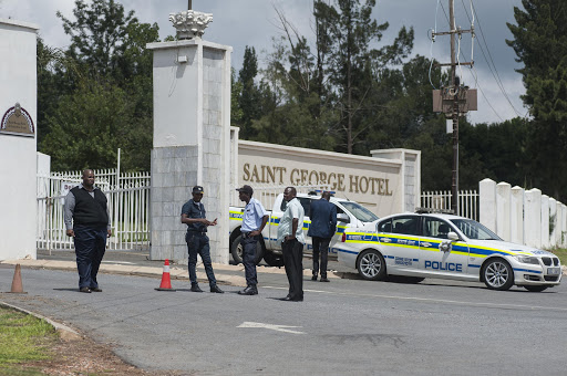 Police and security outside the St George Hotel in Pretoria where the ANC's national executive committee meeting got underway on Friday, 18 March.