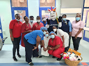 The Tell organisation visited Chris Hani Baragwanath Hospital's paediatric burn Unit with mascot Zane.  The unit cares for children under nine who have burn wounds.