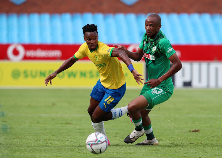 Themba Zwane of Mamelodi Sundowns challenged by Xola Mlambo of AmaZulu