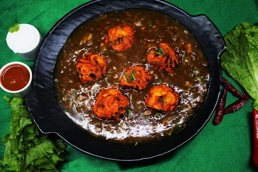 Veg Momos In Machurian Gravy