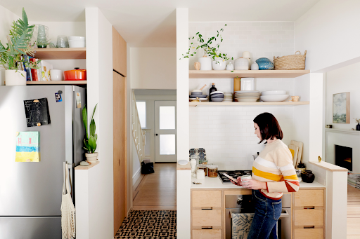 A girl in the kitchen using her phone