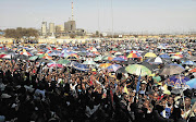 A file photo of Lonmin mineworkers gather at Wonderkop stadium in Marikana, North West, 