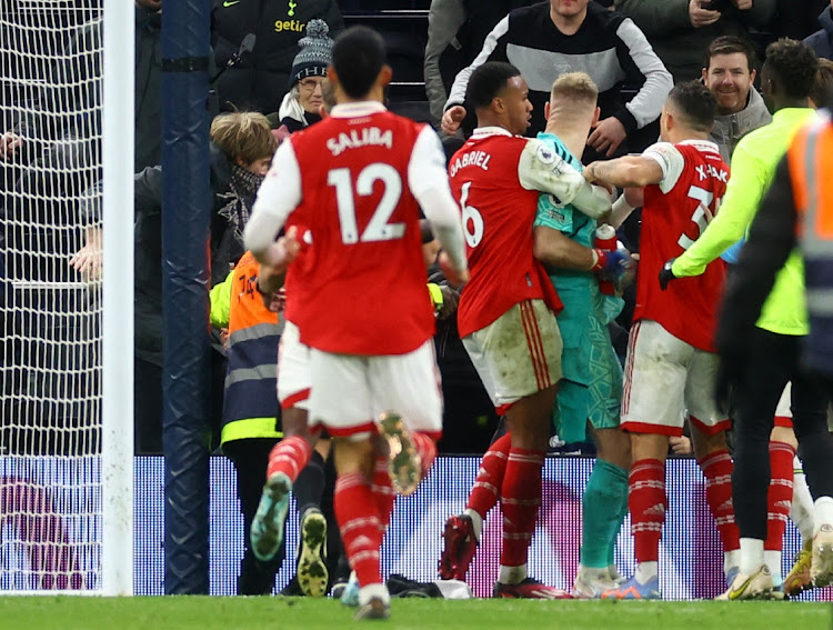 Arsenal's Aaron Ramsdale clashes with a Tottenham Hotspur fan after the match at Tottenham Hotspur Stadium in London on January 15 2023.