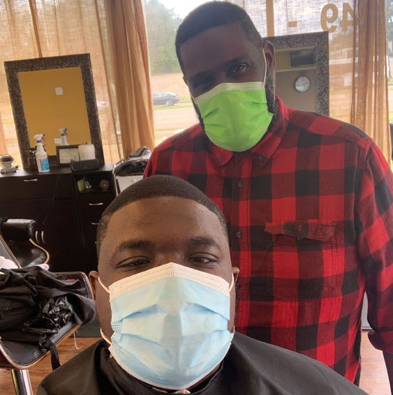 Donald Hall and Vincent Lipford at a barber shop in Memphis, Tennessee, US, March 23 2021. Picture: HANDOUT VIA REUTERS/HOPE CREDIT UNION