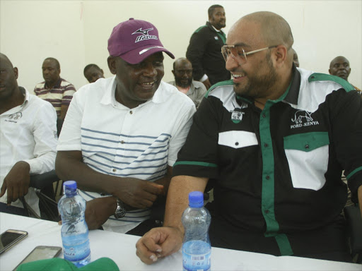 Nyali MP Hezron Awiti chats with Mombasa senatorial aspirant Yasser Bajaber during a stakeholder meeting at Koblez Hall in Mvita, Mombasa County on January 2.Photo / JOHN CHESOLI