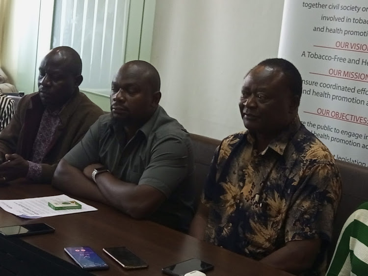 Consumer Information Network CEO Samuel Ochieng, Kenya Tobacco Control Alliance national coordinator Thomas Lindi and chairperson Joel Gitali during a press conference in Nairobi on November 30.
