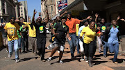 Malema supporters arrive at Luthuli House.