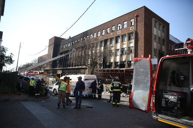 Officials cordoned off areas around the run-down Johannesburg CBD building destroyed by a blaze on Thursday.