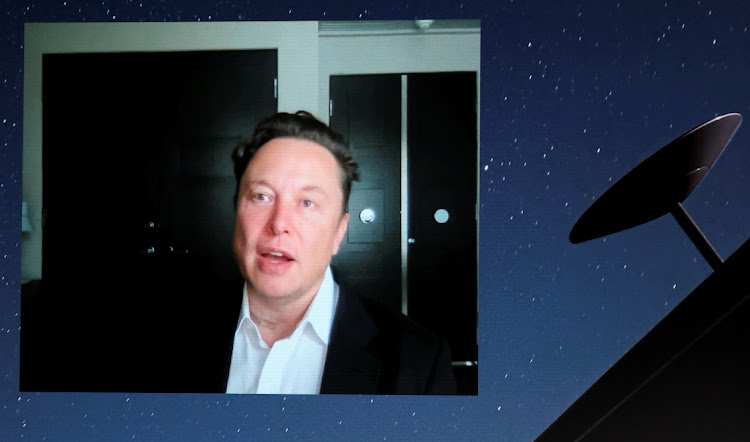 SpaceX founder and Tesla CEO Elon Musk speaks on a screen during the Mobile World Congress (MWC) in Barcelona, Spain, June 29, 2021.