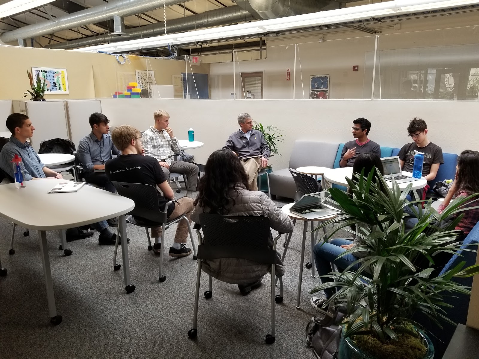 people sitting around tables