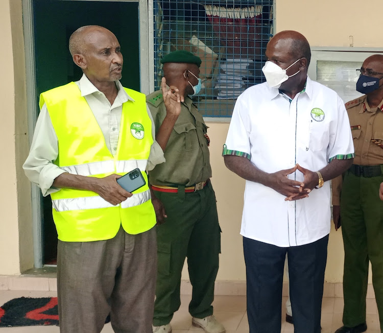 The Independent and Electoral Boundaries Commission chairman Wafula Chebukati has a word with Garissa county elections manager Hussein Gure after a meeting at the county commissioner's office on Tuesday, February 1. .