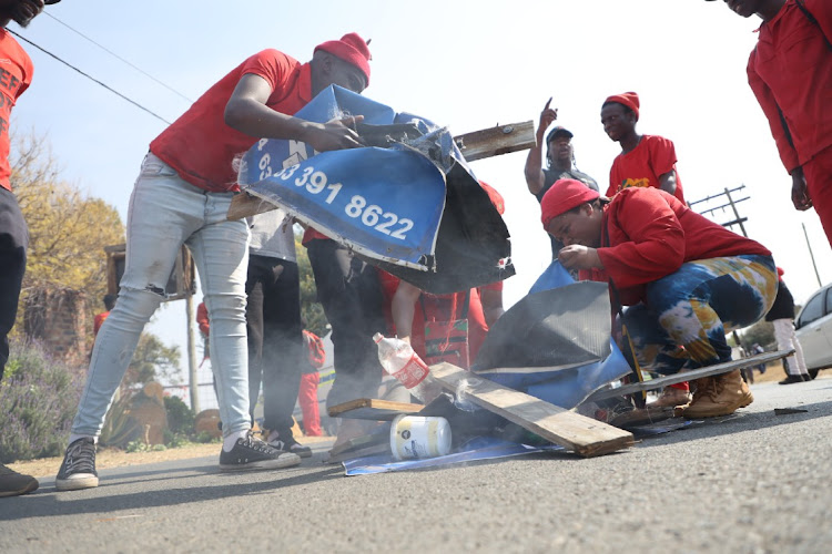 EFF members demonstrating outside Crowthorne Christian Academy in Midrand. The school has since been closed after it was revealed it's operating illegally.