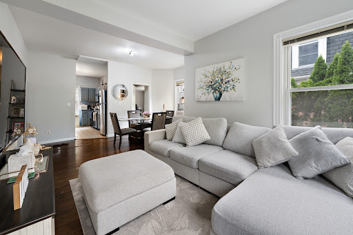 Modern living room with grey sectional sofa in this luxury apartment / penthouse for rent in Greenwich ($4,100)