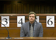 EXPRESSIONLESS   Murder-accused Henri van Breda listens to blood splatter expert Captain Marius Joubert giving evidence at his trial in the Cape Town  High Court. 