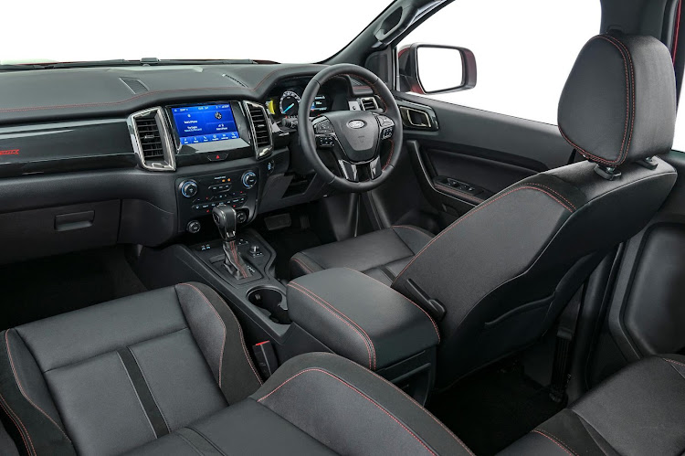 A smart interior with red stitching and Stormtrak badges.