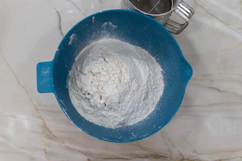 Sifted Flour, Baking Soda, And Salt In A Bowl.