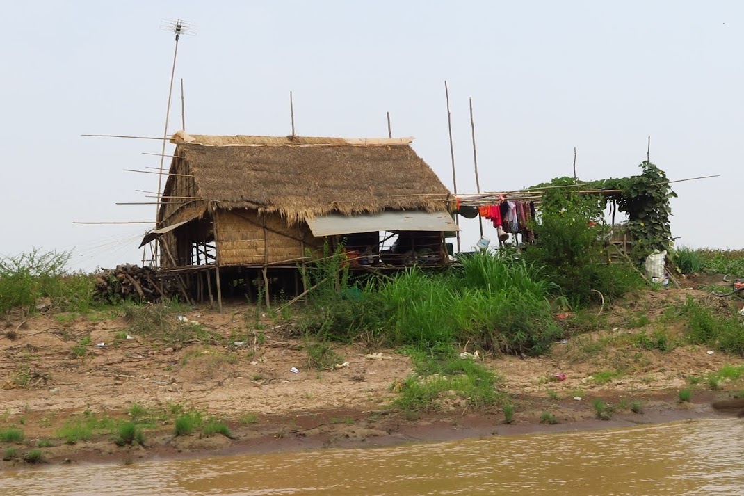 boat trip downstream from the stilt village of Kampong Kheang to a floating village in the middle of Tonle Sap and back