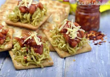 Maggi and baked beans on a cracker