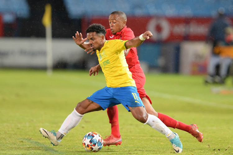 Andisa Dlamini of Summerfield Dynamos and Kermit Erasmus of Mamelodi Sundowns during the Nedbank Cup quarter final match at Loftus Versfeld Stadium on April 9 2022 in Pretoria.