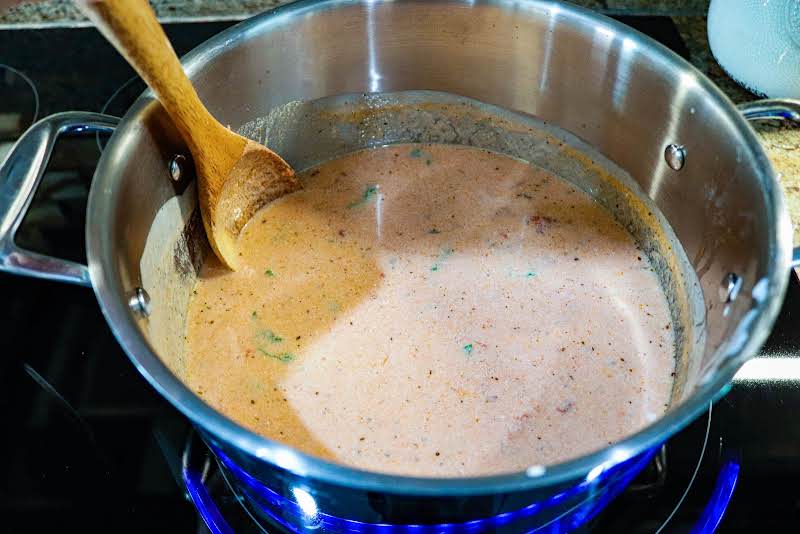 Tomato Soup Ingredients Simmering In A Saucepan.