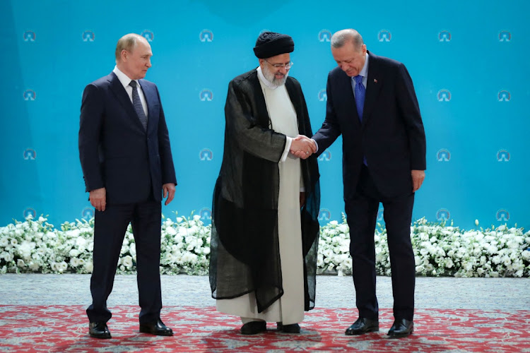 Russian President Vladimir Putin, Turkish President Recep Tayyip Erdogan and Iranian President Ebrahim Raisi meet before a summit of leaders from the guarantor states of the Astana process, designed to find a peace settlement in the Syrian conflict, in Tehran, Iran, on July 19 2022.