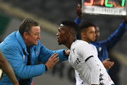 Gavin Hunt and Thabang Monare of Bidvest Wits during the Absa Premiership match between Orlando Pirates and Bidvest Wits at Orlando Stadium on August 15, 2018 in Johannesburg, South Africa. 