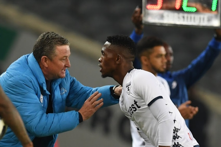 Gavin Hunt and Thabang Monare of Bidvest Wits during the Absa Premiership match between Orlando Pirates and Bidvest Wits at Orlando Stadium on August 15, 2018 in Johannesburg.