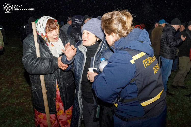 A woman reacts at a site of a residential building damaged during a Russian drone strike, amid Russia's attack on Ukraine, in Vinnytsia region, Ukraine, in this handout photo released March 15 2024. Picture: Press service of the State Emergency Service of Ukraine in Vinnytsia region/Handout via REUTERS