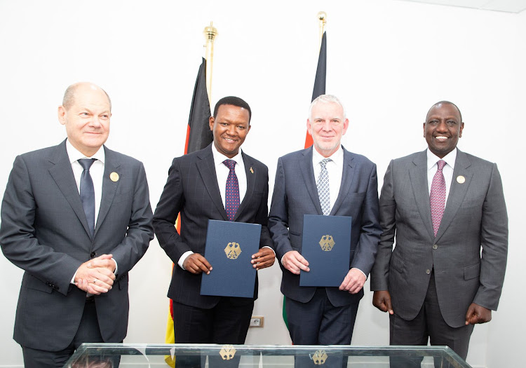 President William Ruto, German Chancellor Olaf Scholz, Foreign Affairs CS Alfred Mutua and another official during the signing of a joint declaration on Climate and Development Partnership in Shamar El Sheikh, Egypt