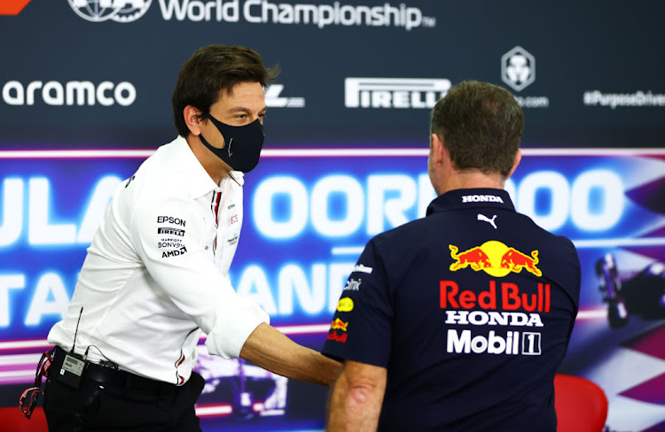 Mercedes GP Executive Director Toto Wolff and Red Bull Racing Team Principal Christian Horner talk in the Team Principals Press Conference during practice ahead of the F1 Grand Prix of Qatar at Losail International Circuit on November 19, 2021 in Doha, Qatar.