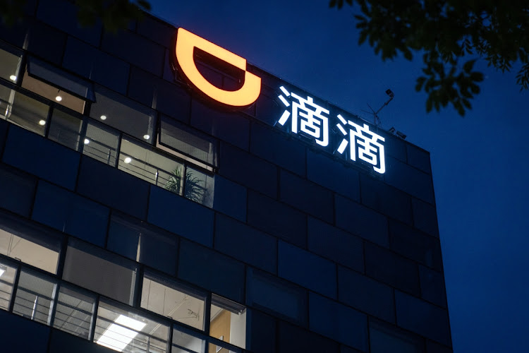 Illuminated office windows are shown at night at Didi Global Inc's headquarters in Beijing, China. Picture: BLOOMBERG/YAN CONG