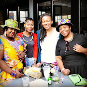 Thula Ngonyama, in white, with patrons at her eatery.