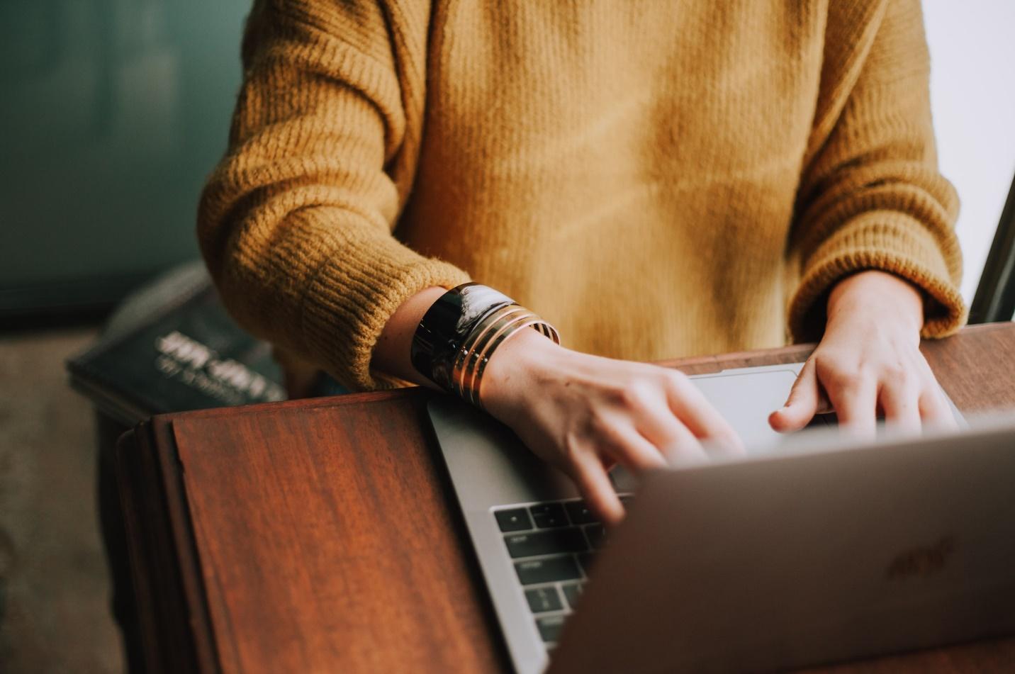 A person running an E-commerce on a laptop