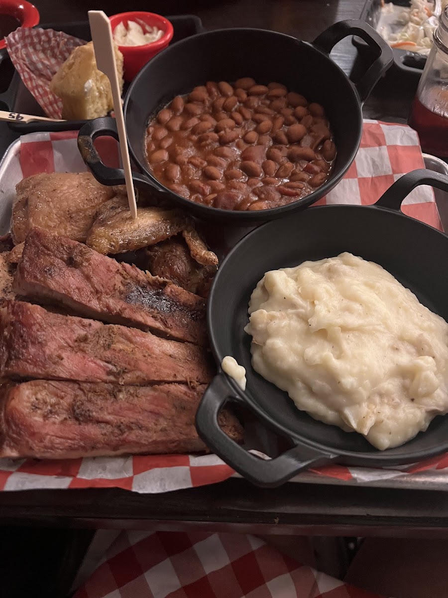 Chicken, ribs, beans, potatoes platter