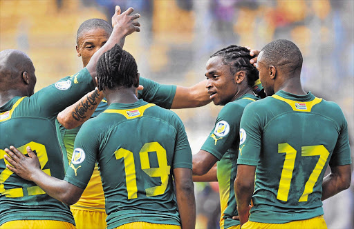 Bafana midfielder Siphiwe Tshabalala (2nd right) is congratulated by teammates after scoring against the CAR in the World Cup qualifier at the Amadou Ahidjo Stadium in Yaounde, Cameroon, on Saturday