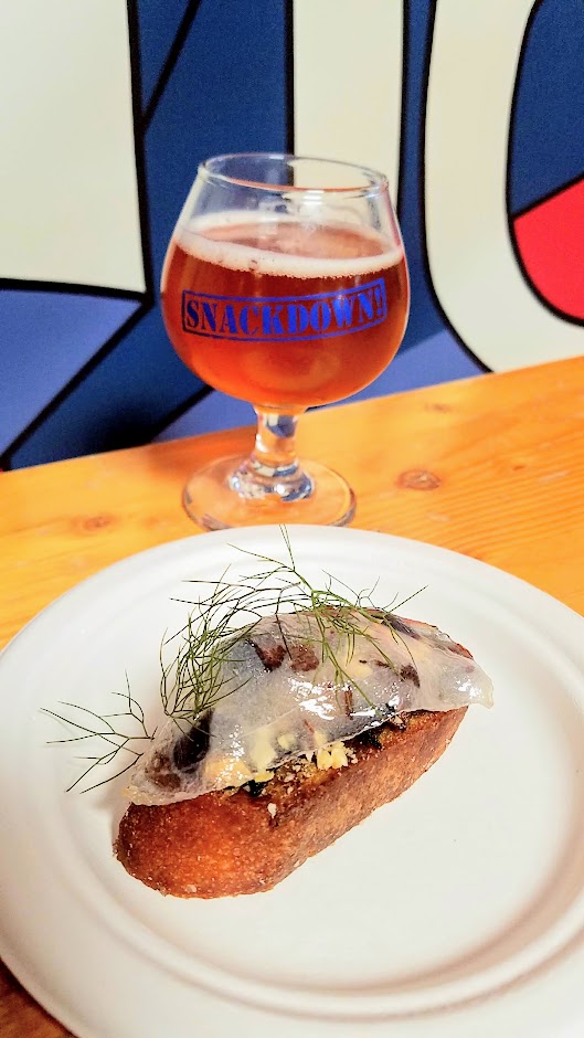 Snackdown 2018 pairing of Gigantic/Spätzle & Speck brought together Porcini Toasts, smoked cherries, hazelnuts, lardo with the Gigantic beer dubbed Playdate - Cocktail Beer w/ Pomegranate, Ginger, Tangerine aged in Bourbon Barrels