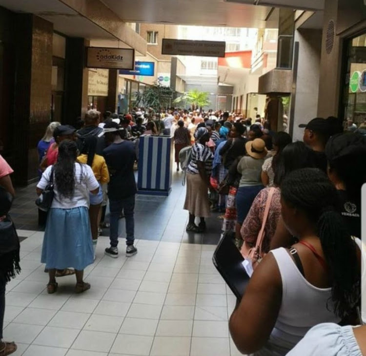 Queues at one of the Gauteng education department district offices. A petition to scrap the online applications system has been launched.