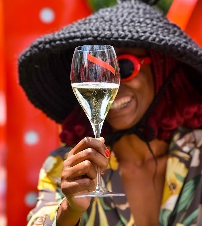 Cultural influencer Kwena Baloyi enjoying a glass of champagne at the GH MUMM brunch