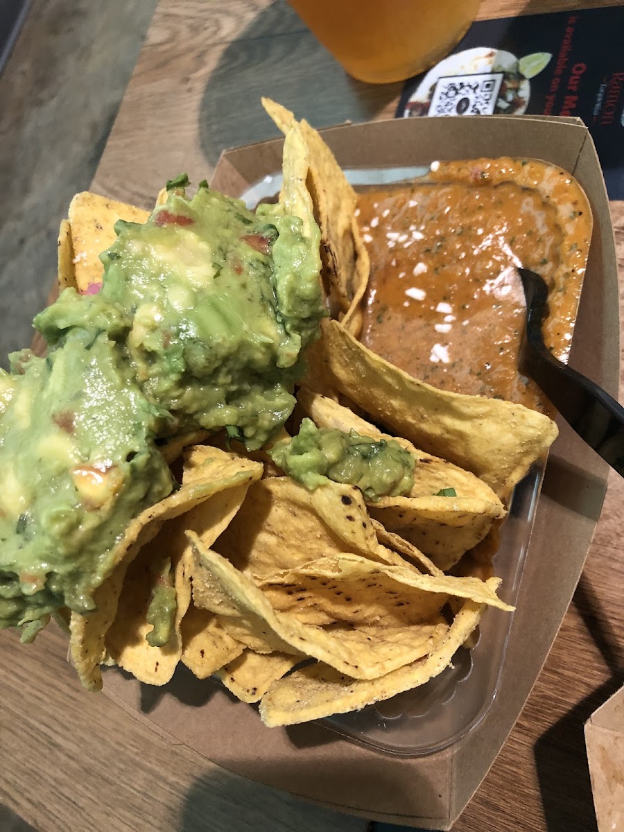 Chips loaded with pickled onions, mexican cheese, guacamole and salsa