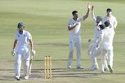 Mitchell Starc of Australia celebrates the wicket of Theunis de Bruyn of the Proteas with his team mates during day 2 of the 1st Sunfoil Test match between South Africa and Australia at Sahara Stadium Kingsmead on March 02, 2018 in Durban. 
