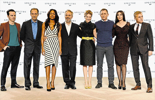 TIES THAT BOND: The cast and director of the new James Bond movie: Andrew Scott, Ralph Fiennes, Naomie Harris, director Sam Mendes, Lea Seydoux, Daniel Craig, Monica Bellucci and Christoph Waltz