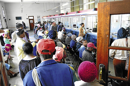 No matter what your bank SMS says, if the cashier’s card machine can produce a slip saying “transaction failed” or something similar, your payment didn’t actually go through. PICTURED: Social-grant beneficiaries queue at a Postbank branch to receive their grants.