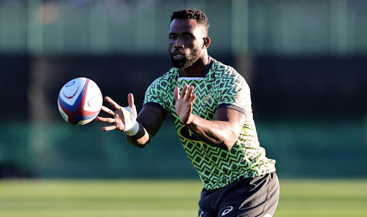 Siya Kolisi catches the ball during the Springboks training session held at The Lensbury on November 22, 2022 in Teddington, England.